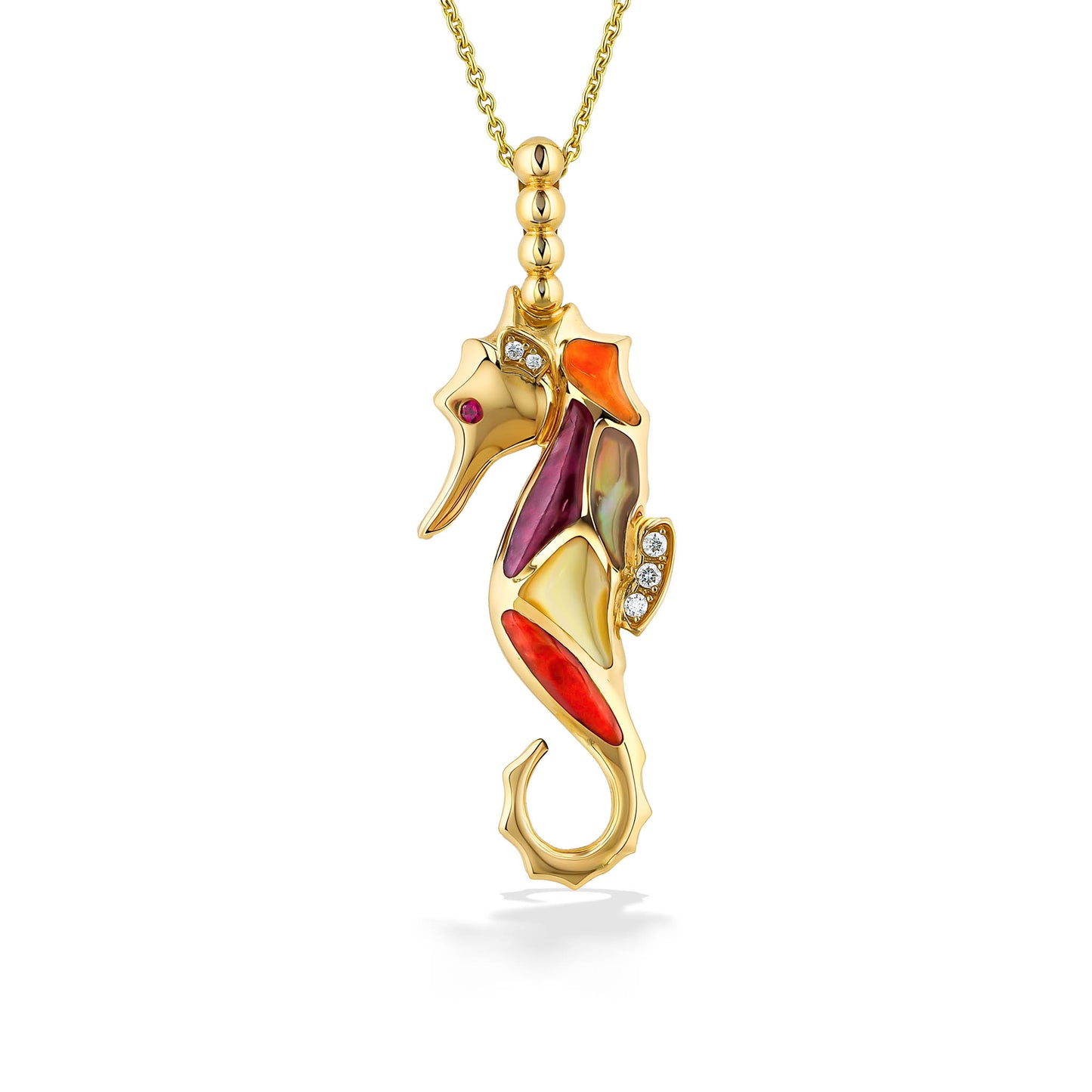 Seahorse pendant with lifelike details—ruby eye, mixed spiny oyster body & diamond accent set in yellow gold. Item No. 767861