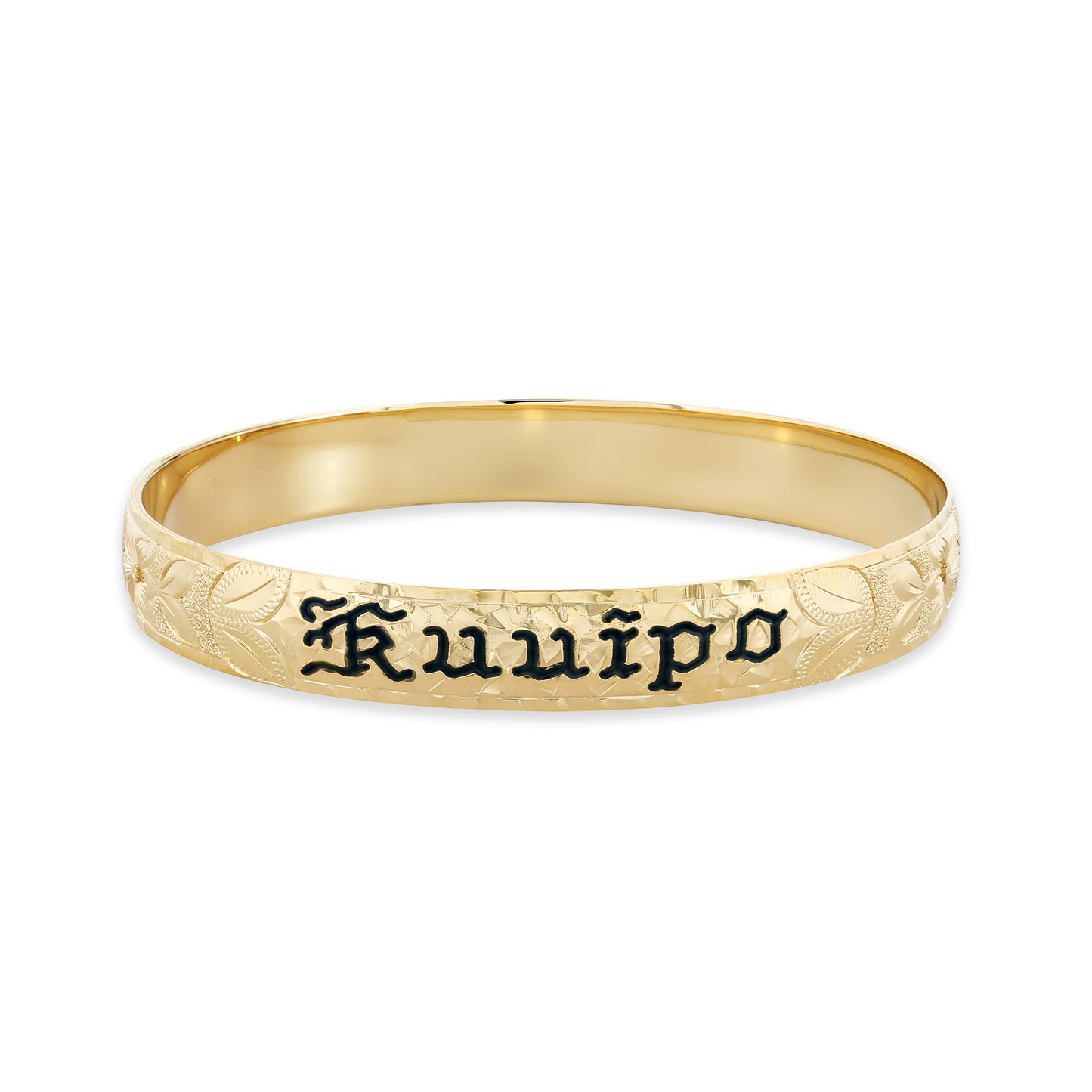 Bold yellow gold bangle displays engraved floral patterns and the name Kuuipo highlighted in black enamel. Item No. 60090