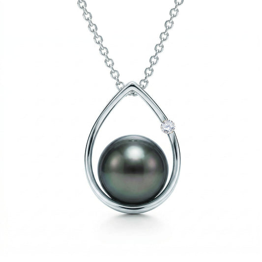 Elegant 14k white gold raindrop pendant with a 8.5-9mm tahitian pearl and single round diamond on box chain. Item No. 19153