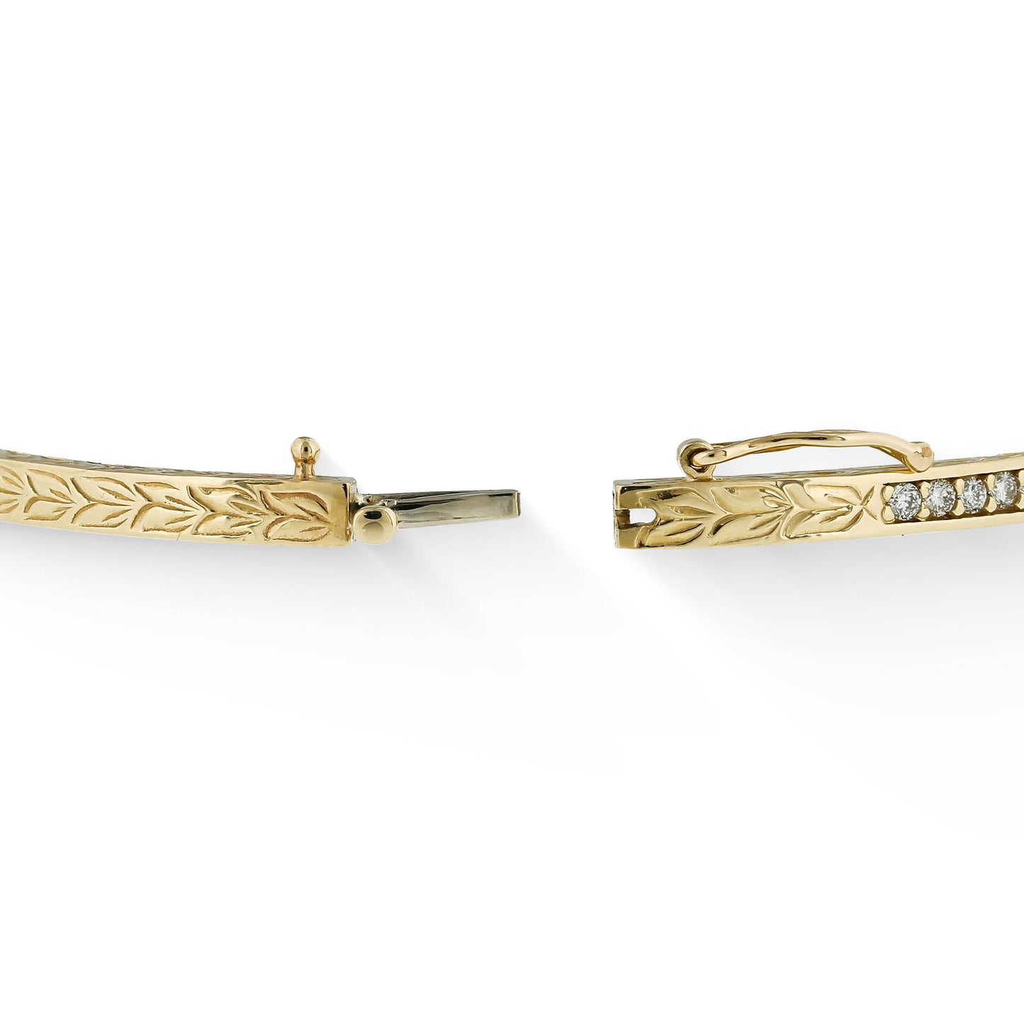 Focused image of the opened box clasp, revealing a 14K white gold tongue for the Maile Scroll Hinged Bangle. Item No. 41779