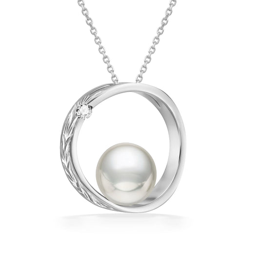 Polished white gold scroll design surrounds a 7mm white Akoya pearl, finished with a 0.02 carat diamond. Item No. 43163