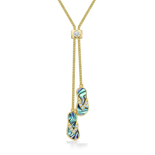 Lariat-style necklace showcasing 2 yellow gold Hawaiian slipper pendants with abalone inlay & diamond accents. Item No. 47563