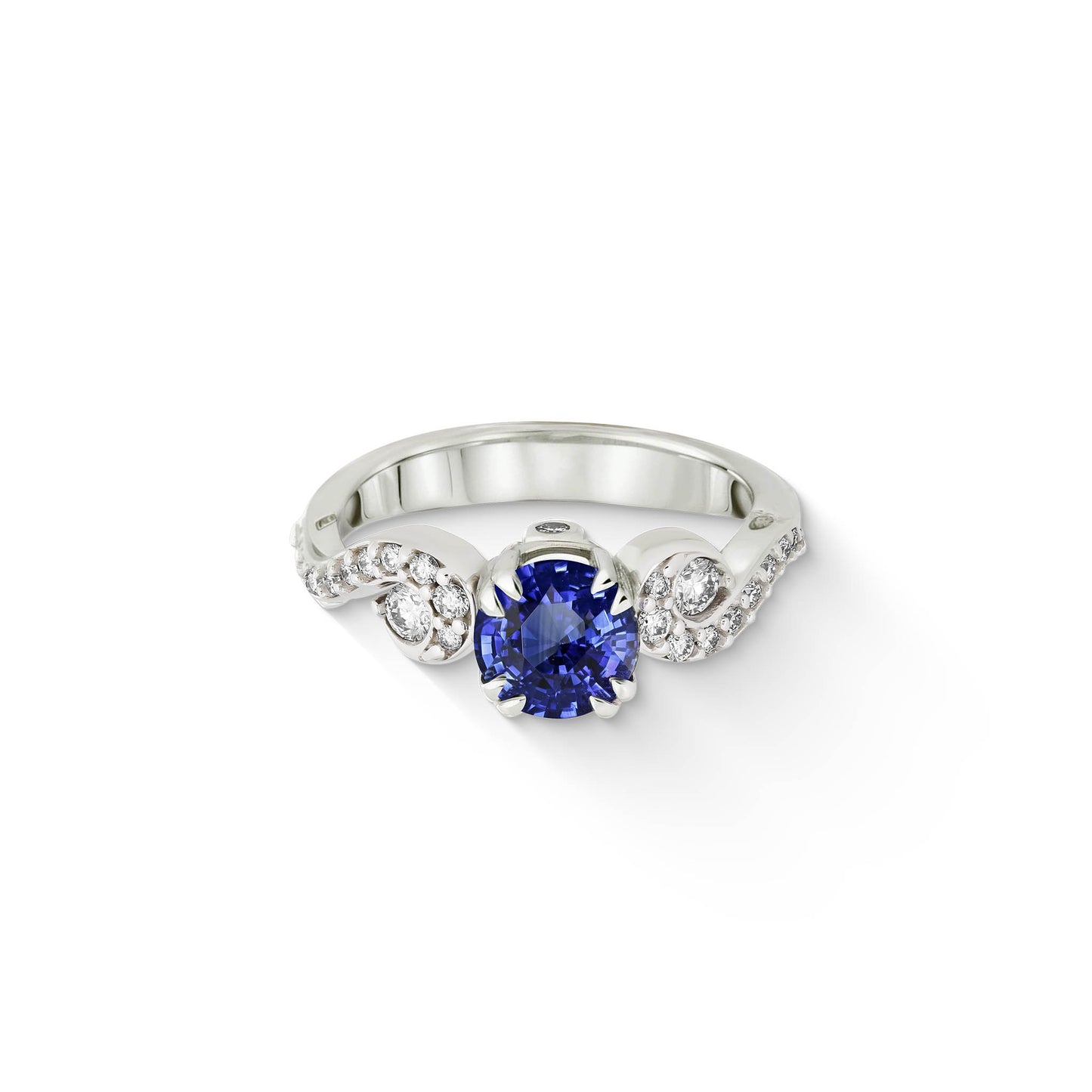 Front view of sapphire & diamond ring highlighting round blue gemstone and symmetrical side diamond detailing. Item No. 43958