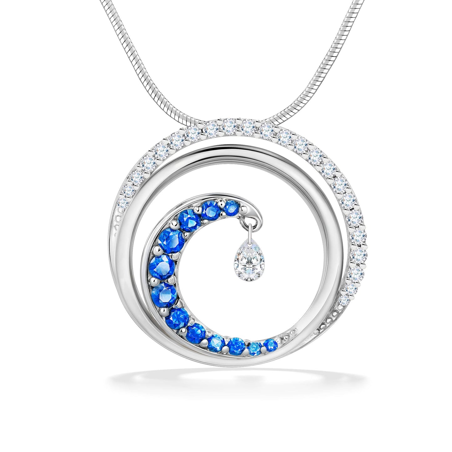 Circle white gold pendant with diamond accents, blue sapphire-lined wave motif & dangling shimmer diamond. Item No. 43595