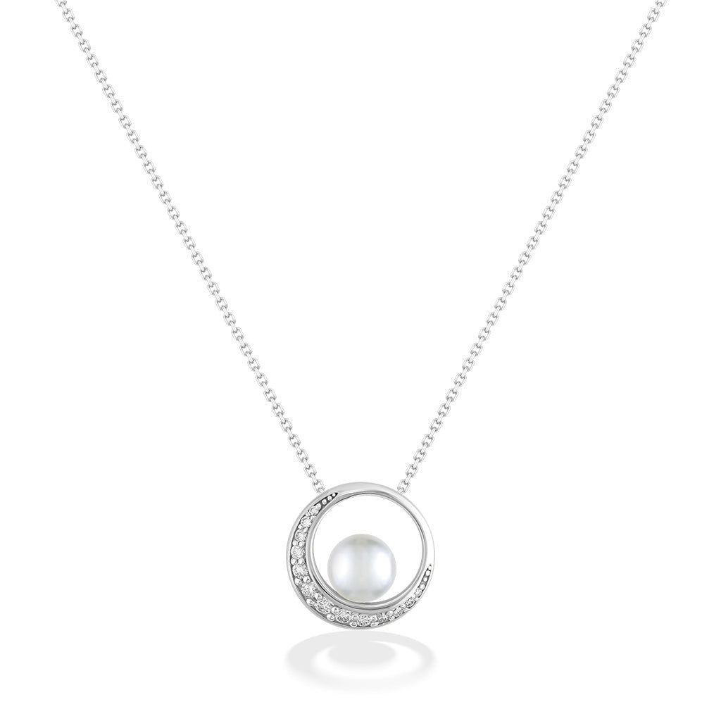 White gold necklace featuring a circular pendant with a glowing 7mm akoya pearl and crescent diamond detail. Item No. 44264