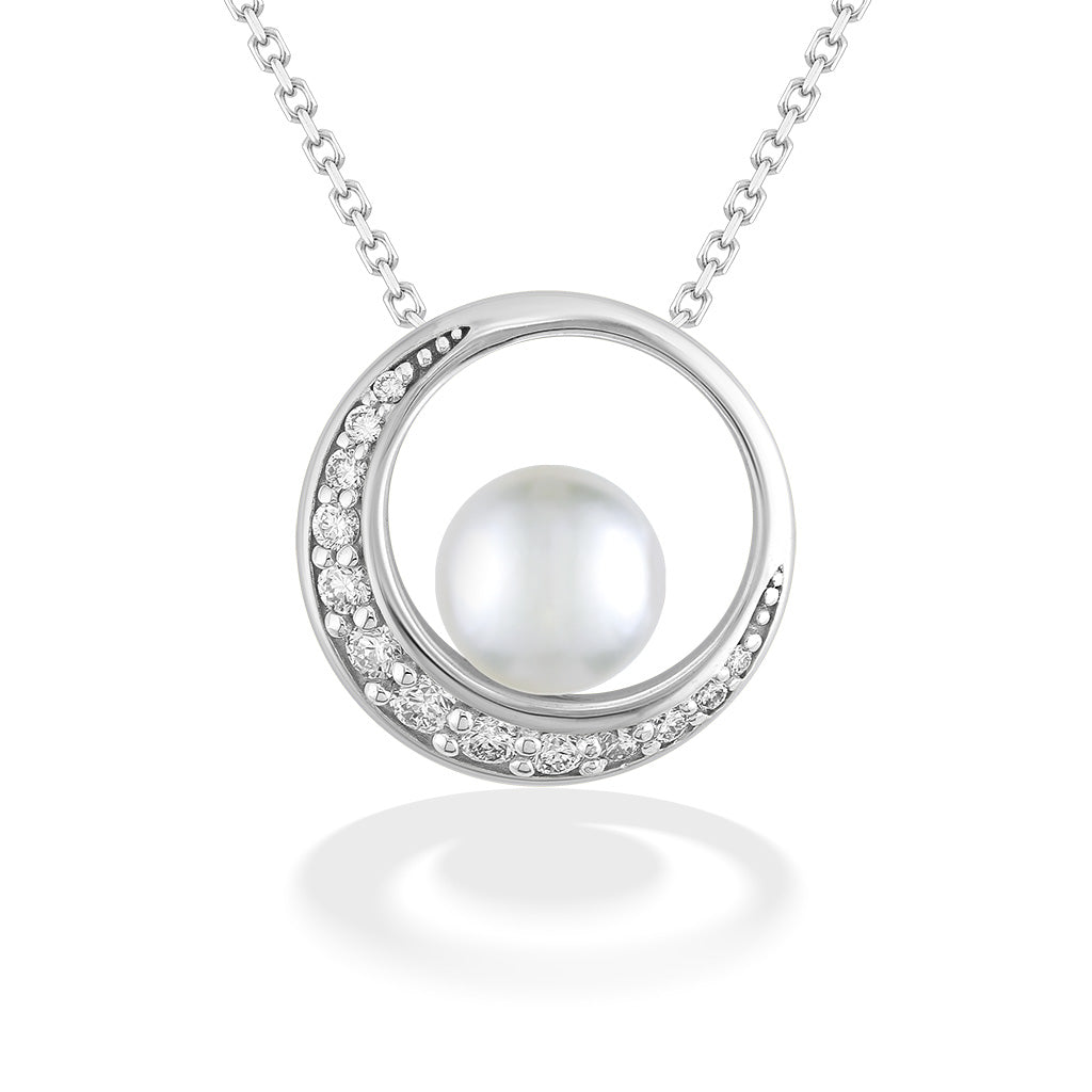 Brilliant 14k white gold pendant encircling a lustrous akoya pearl, detailed with a crescent of diamonds. Item No. 44264