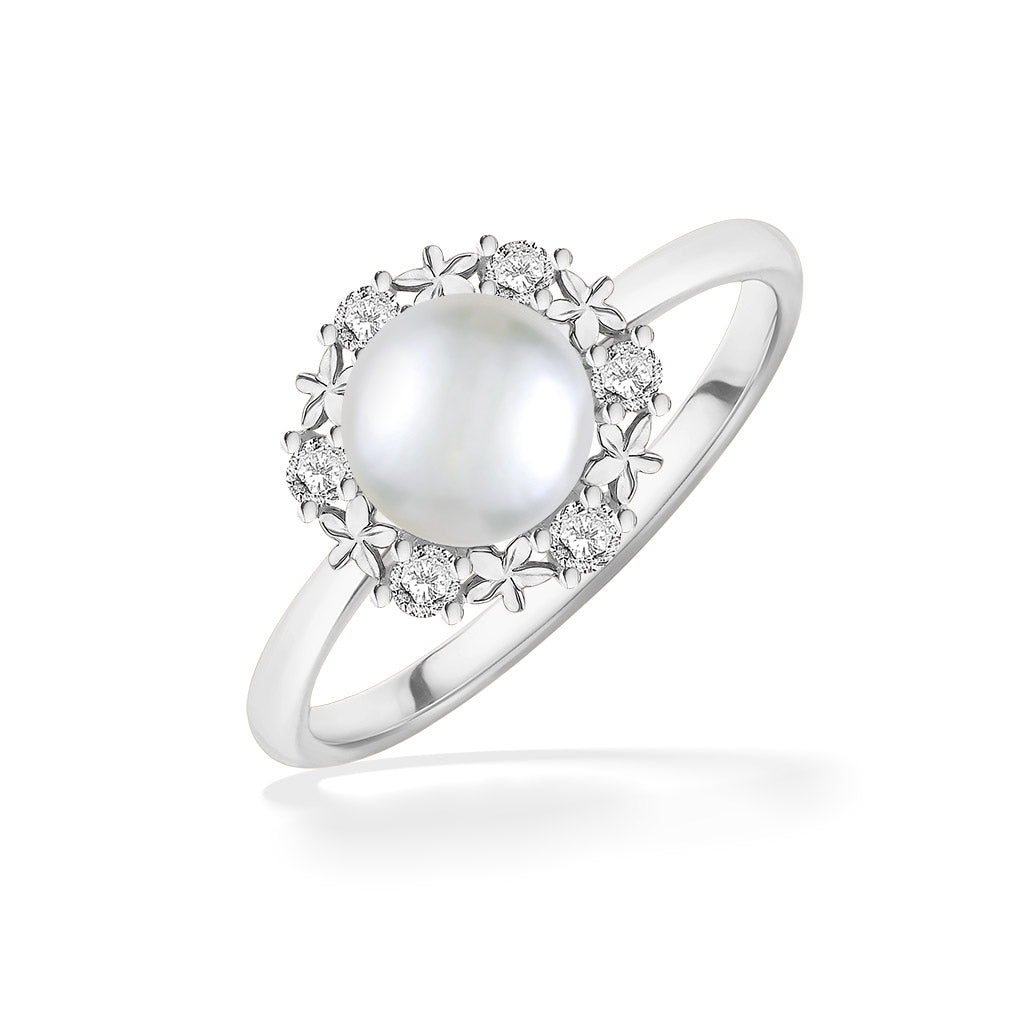 White gold ring with Akoya pearl centerpiece encircled by diamond-accented plumeria detailing. Item No. 44312