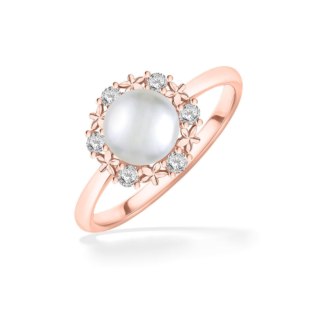 Rose gold ring featuring a luminous Akoya pearl framed by a delicate floral diamond halo. Item No. 44333