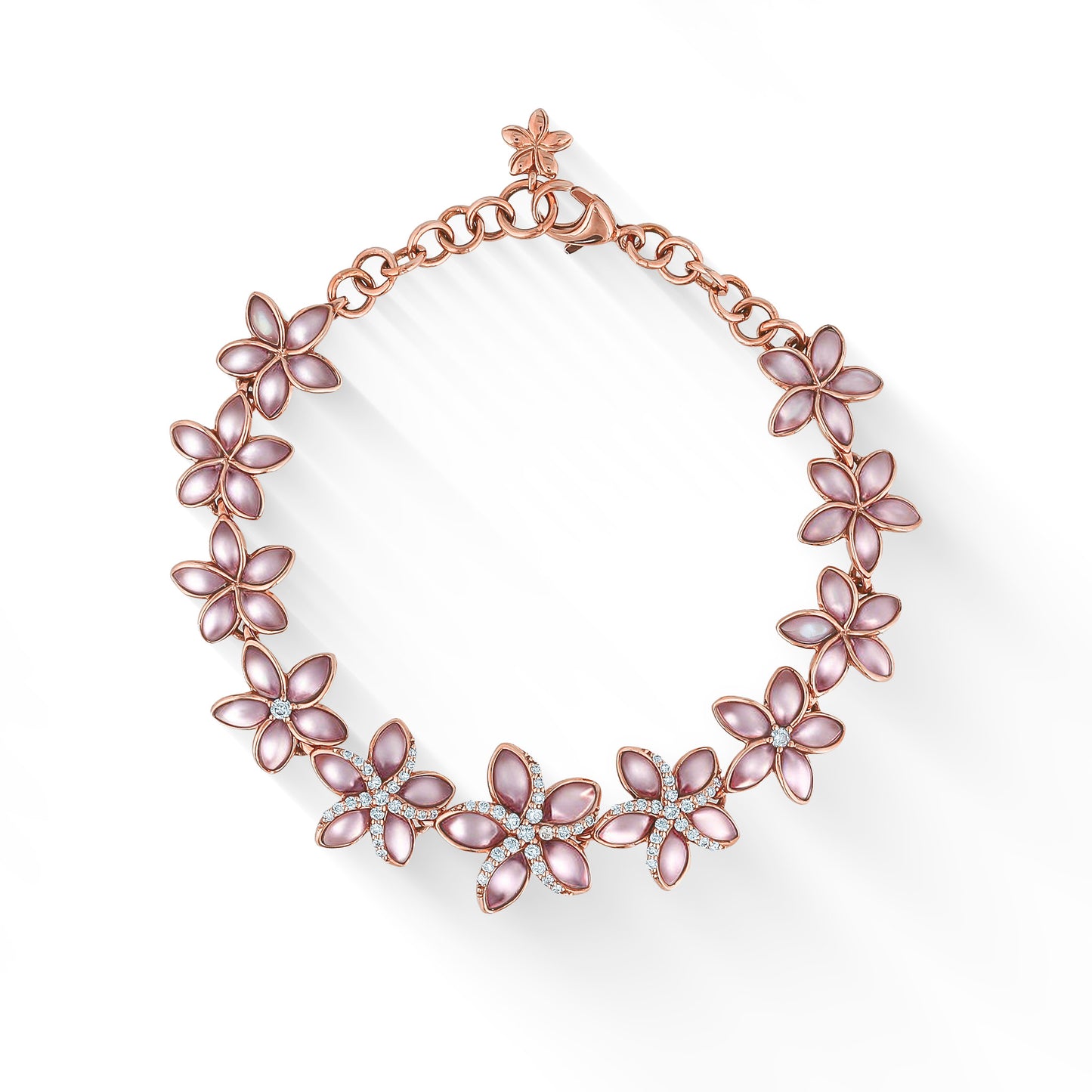 Gorgeous pink mother of pearl plumeria link bracelet with diamond accents, made in 14k rose gold. Item No. 44498