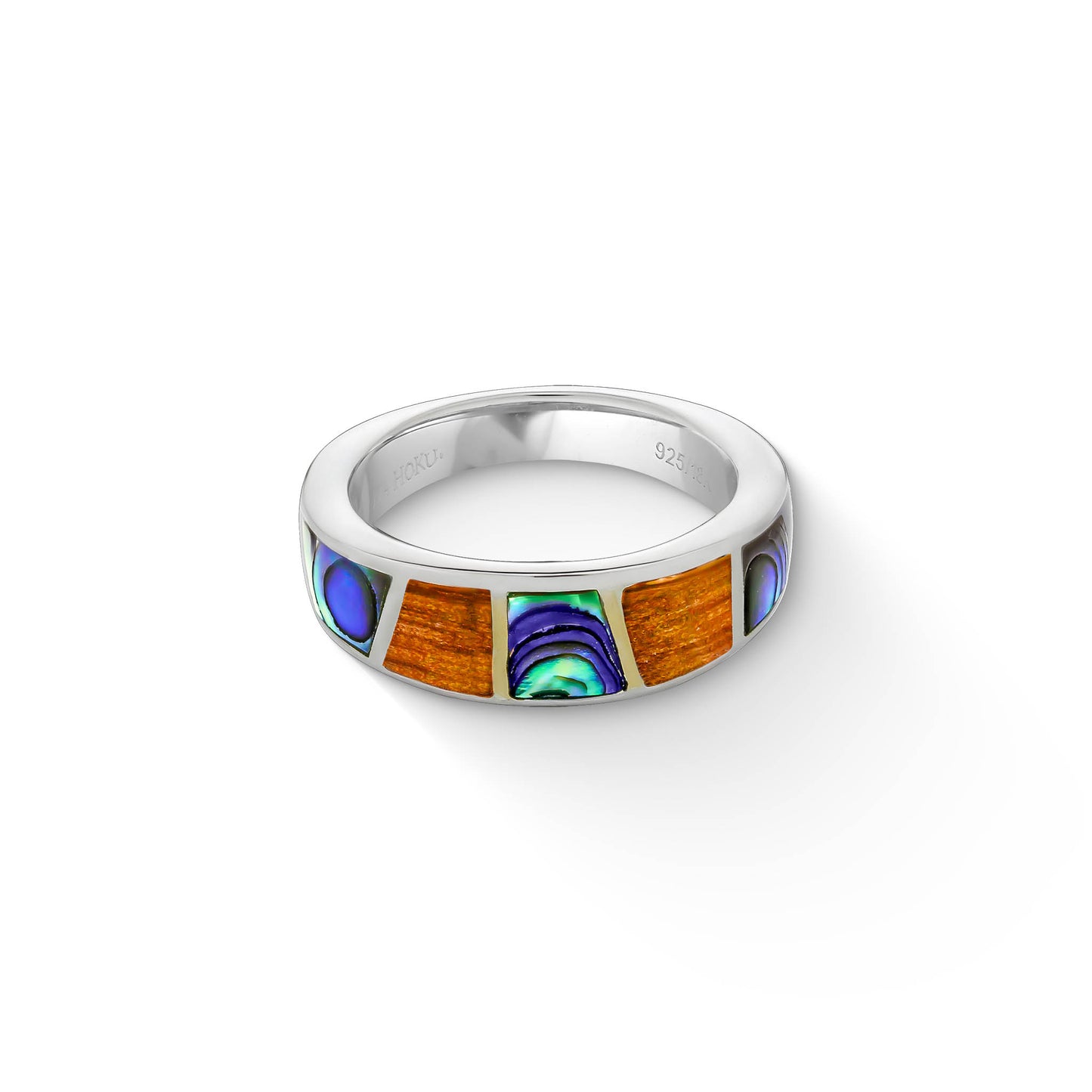 Top view of koa wood and abalone inlay ring highlighting colorful segments and smooth silver setting. Item No. 44577