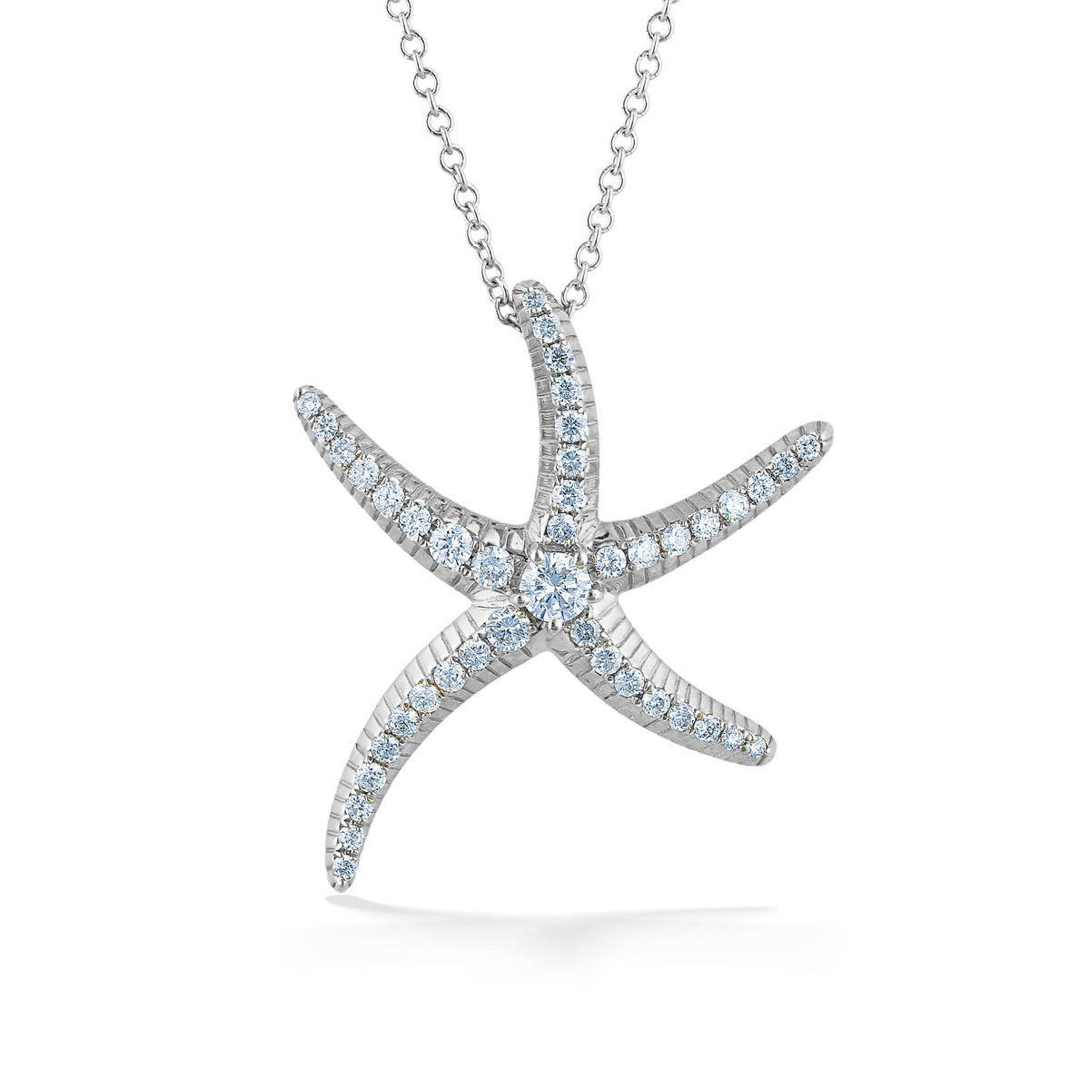 Detailed starfish pendant crafted in 14k white gold with a diamond center & each arm lined with diamonds. Item No. 773345