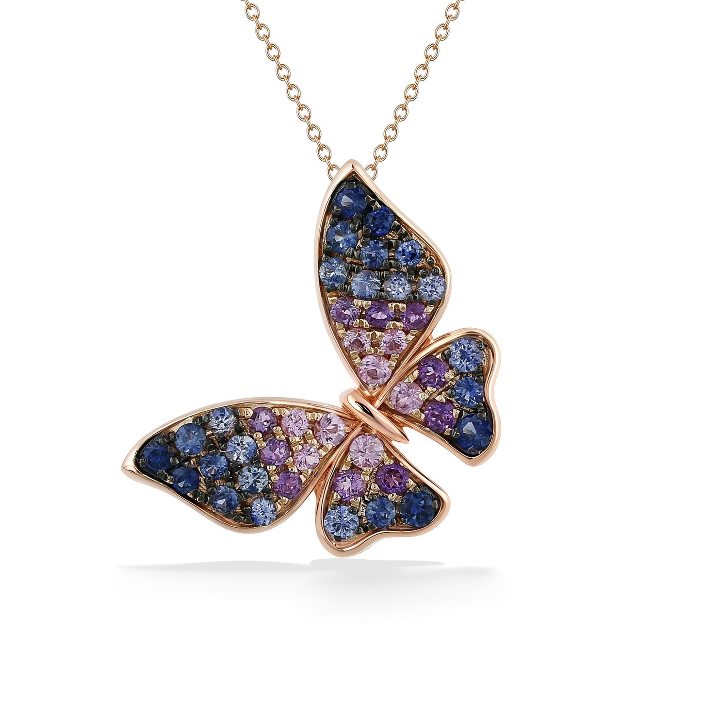 Rose gold butterfly pendant with blue, purple, and pink ombré laid gemstones on a delicate chain. Item No. 773505