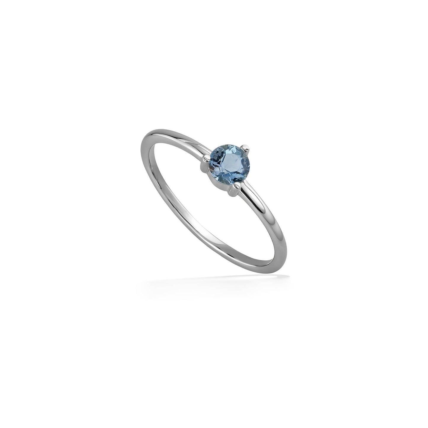 Angled view of a white gold ring with aquamarine showcasing a round 4mm gemstone in a minimalist setting. Item No. 44796