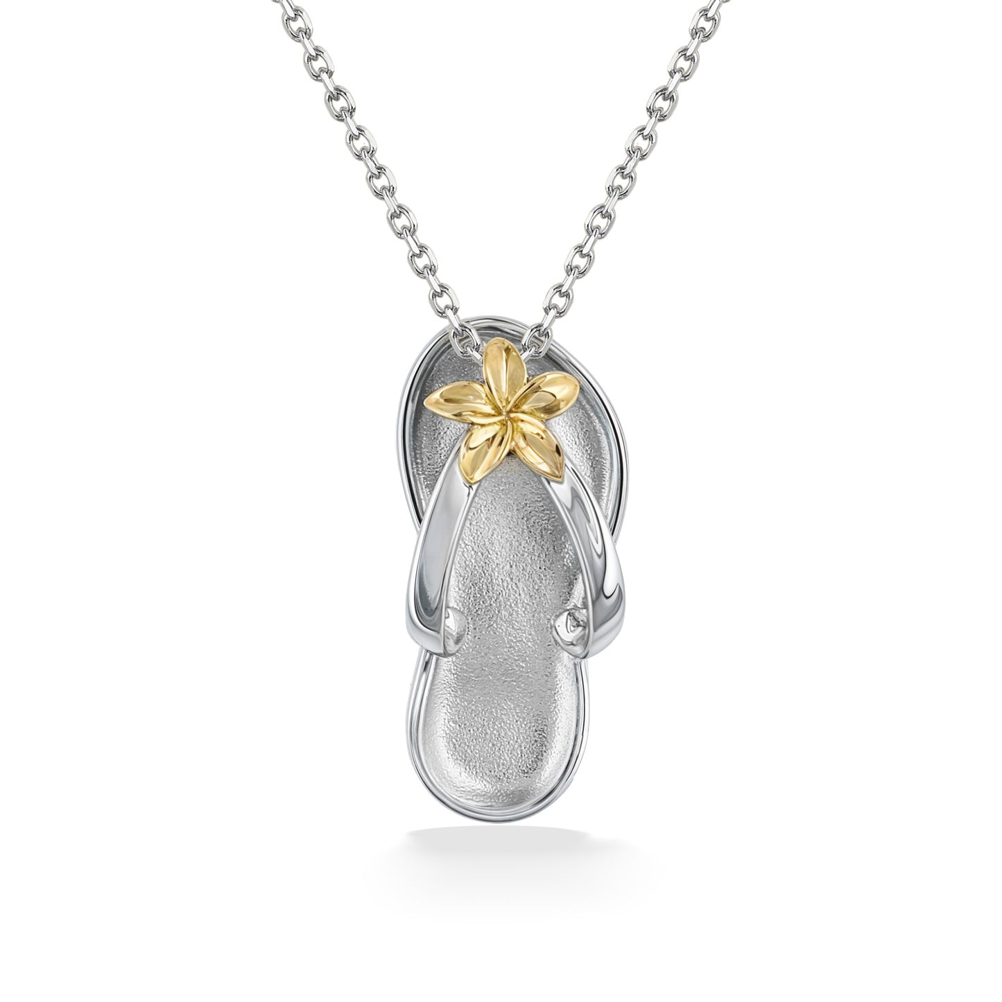 Flip-flop pendant in sterling silver featuring a yellow gold plumeria flower accent at the strap center. Item No. 44816