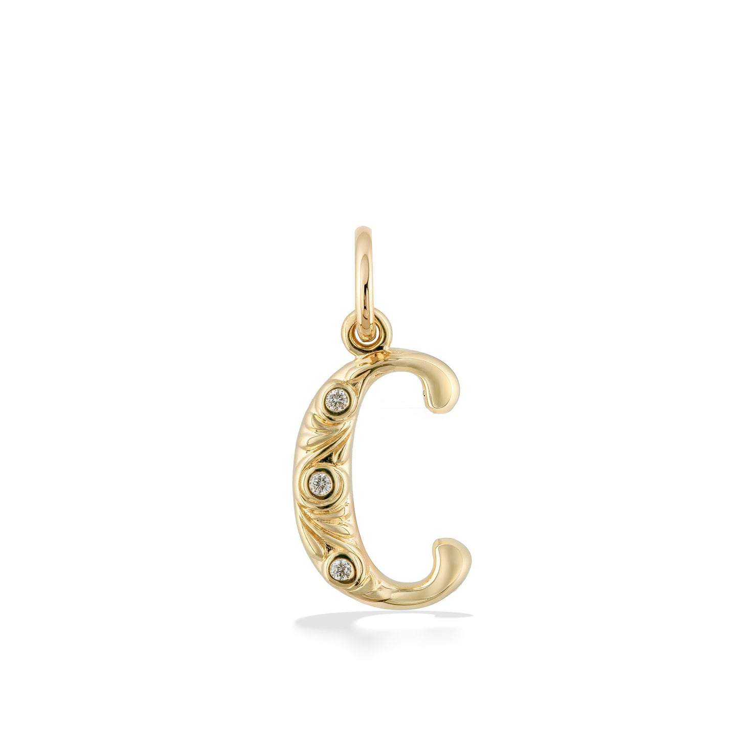 Curved yellow gold letter C initial charm with polished finish and decorative scrollwork set with diamonds. Item No. 44912