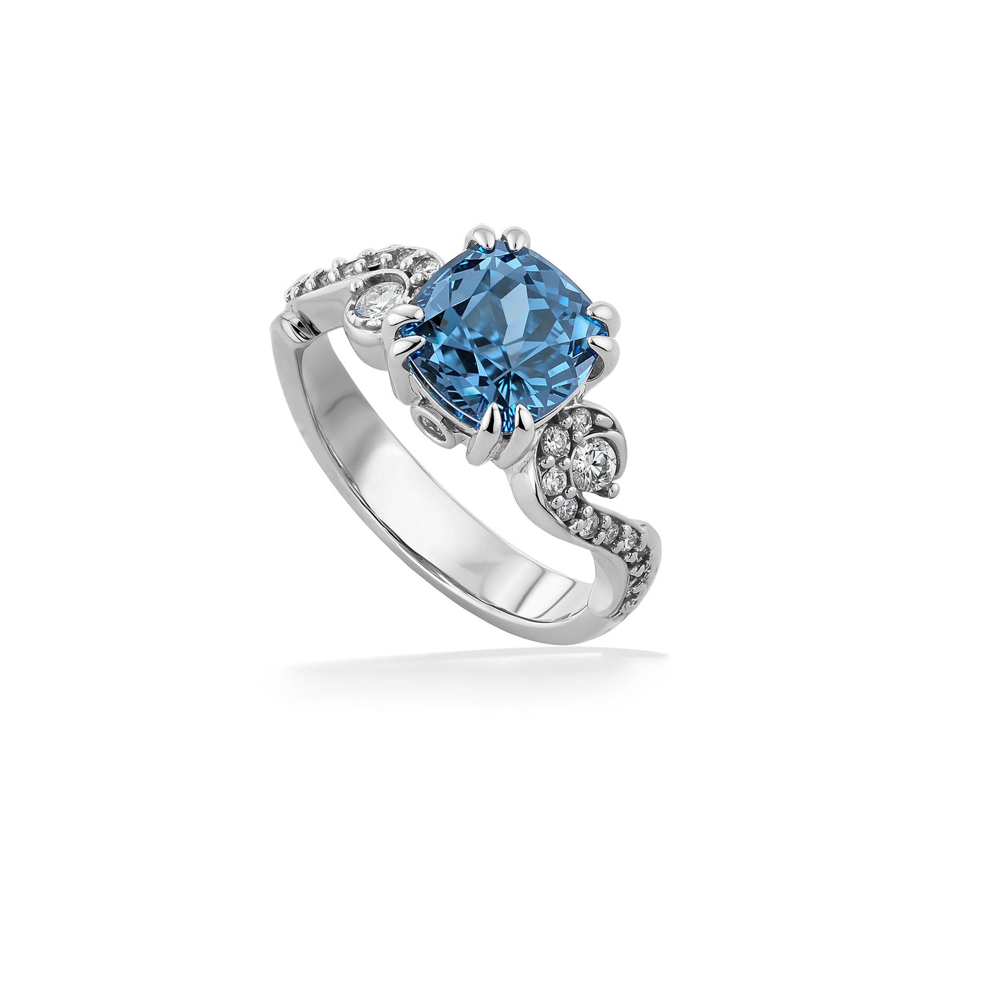 White gold ring with stunning blue zircon center stone and side diamond-accented swirly designs. Item No. 45103