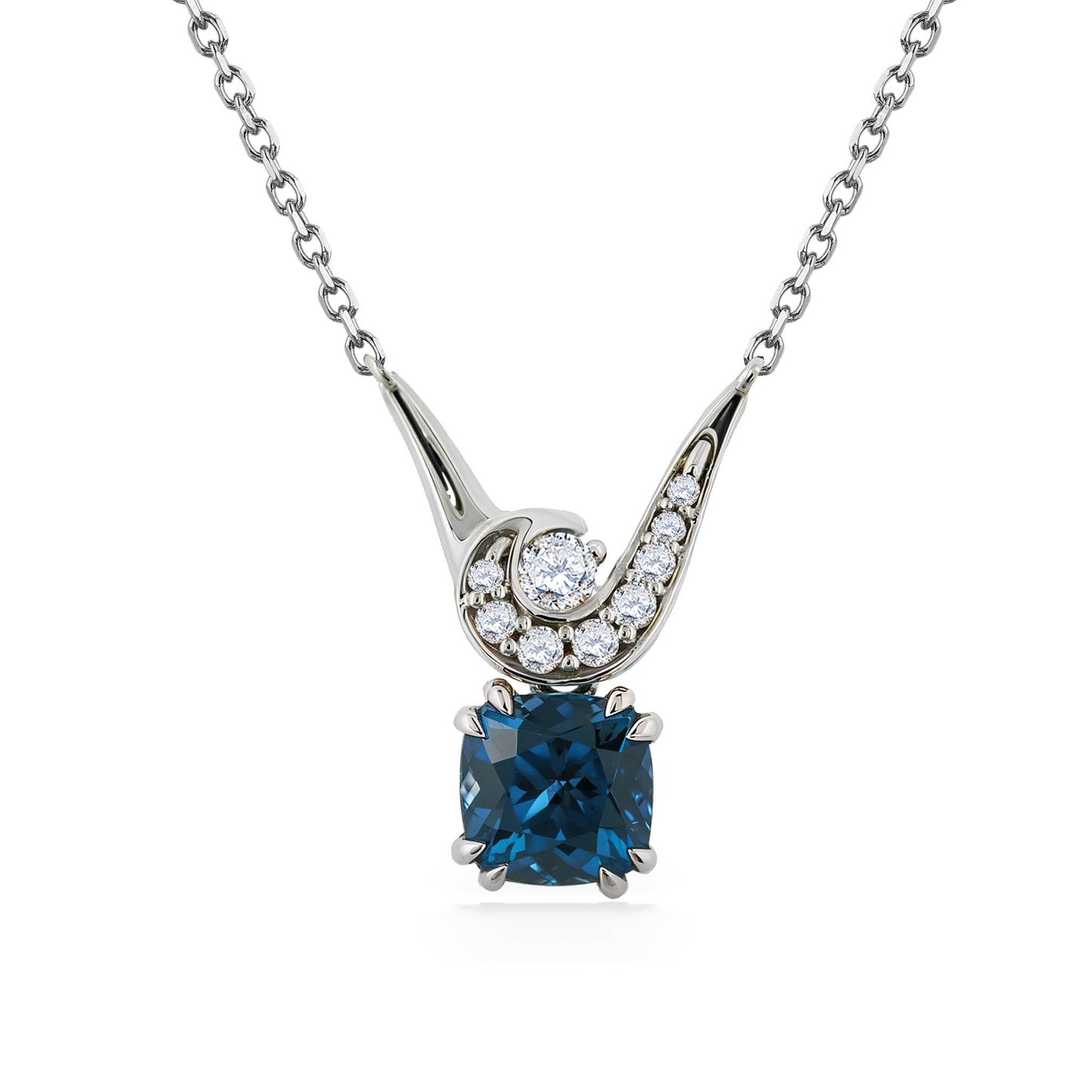 Elegant white gold mauka & makai necklace with cushion-cut blue zircon pendant & crescent diamond setting. Item No. 45114
