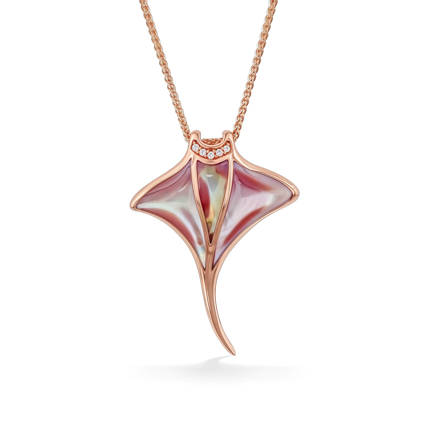 Pink mother of pearl manta ray pendant set in 14k rose gold with a diamond-lined mouth. Item No. 774022