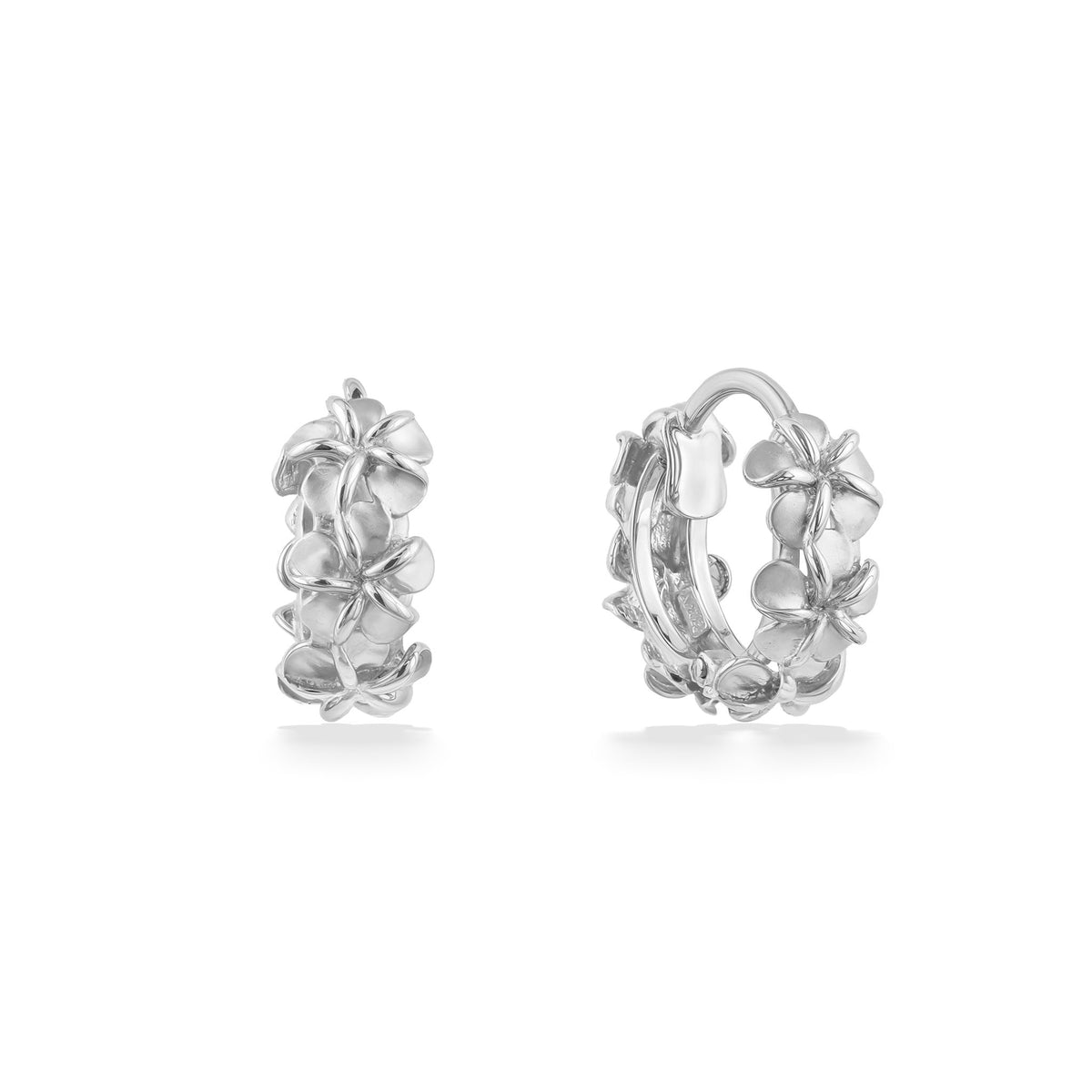 Shown from front & side, white gold plumeria huggies display detailed floral texture & secure hinged clasps. Item No. 45240
