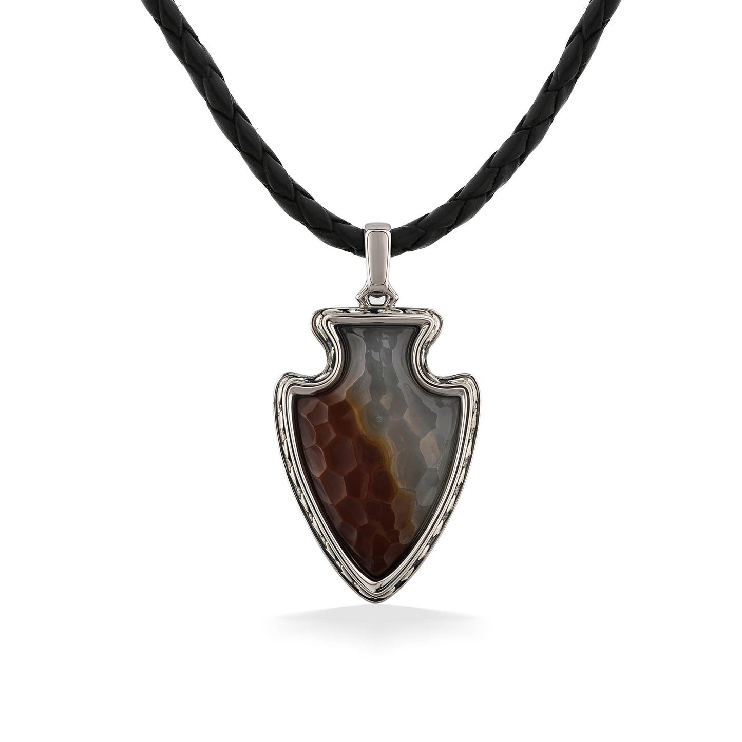A pendant shaped like an arrowhead with brown & gray stone in a silver frame, hung on a black leather cord. Item No. 45305