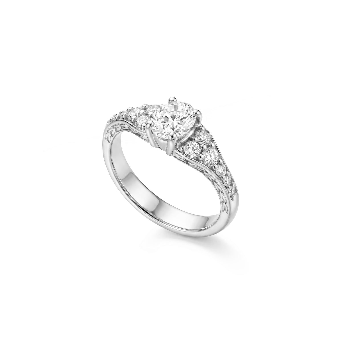 14K solid white gold oval solitaire ring with a 3/4 carat oval diamond center and graduated diamond-set shoulders. Item No. 45442