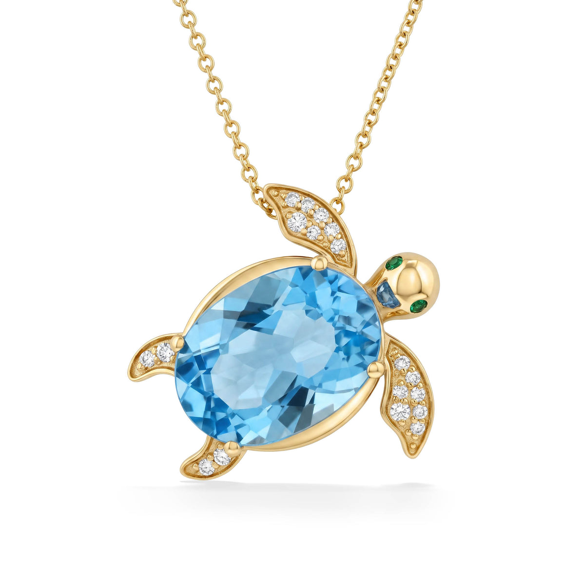 14K Yellow gold sea turtle with blue topaz body and tsavorite eyes with diamond accents. Item No. 774709