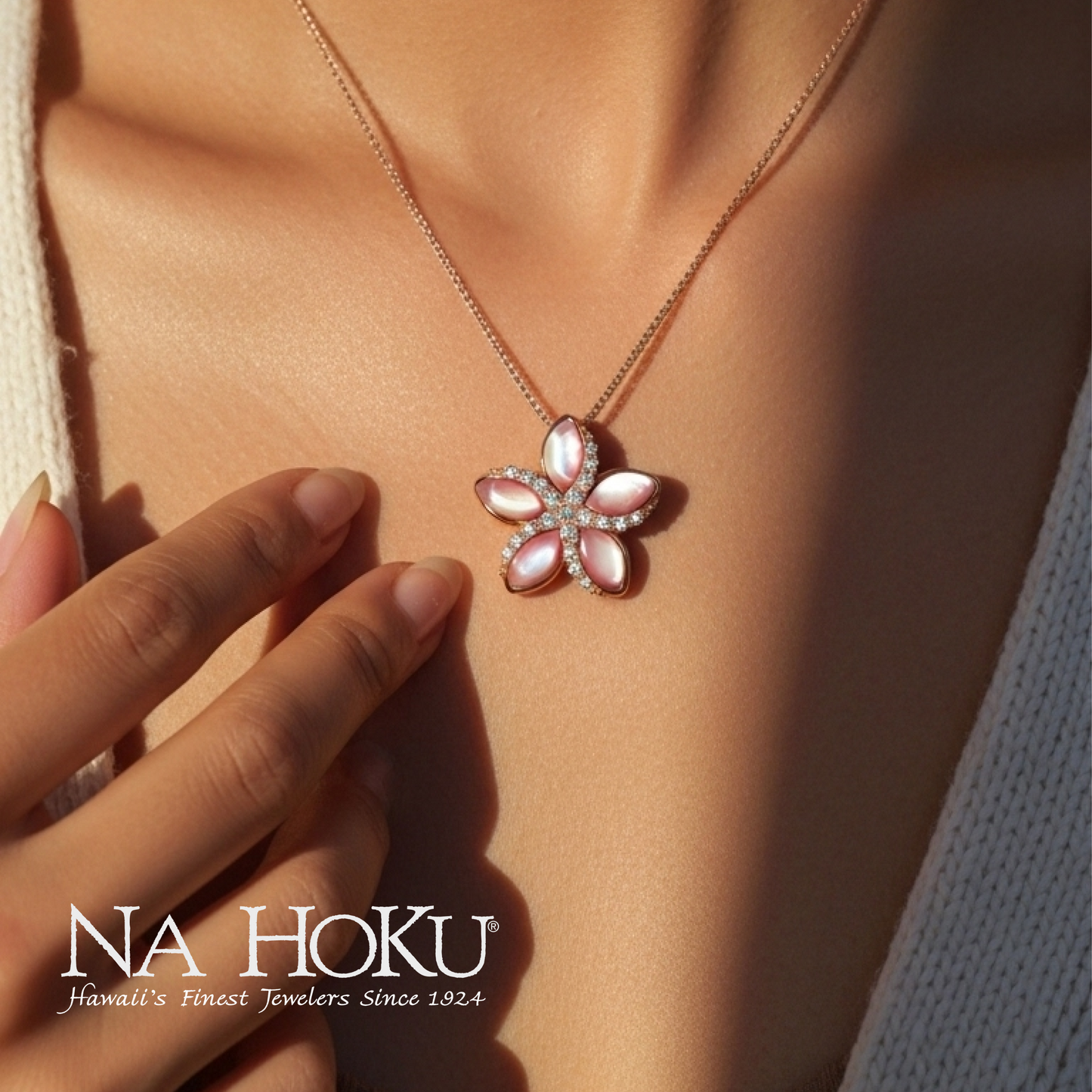 Close up of model wearing rose gold Plumeria pendant with pink mother of pearl petals and diamonds. Item No. 43730
