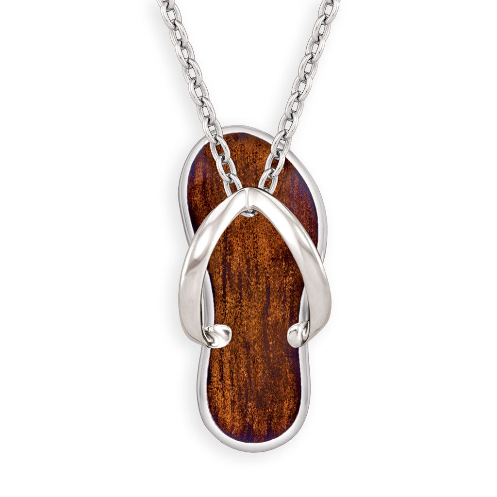Natural koa wood inlay takes center stage on a sterling silver Hawaiian slipper pendant with smooth contours. Item No. 766671