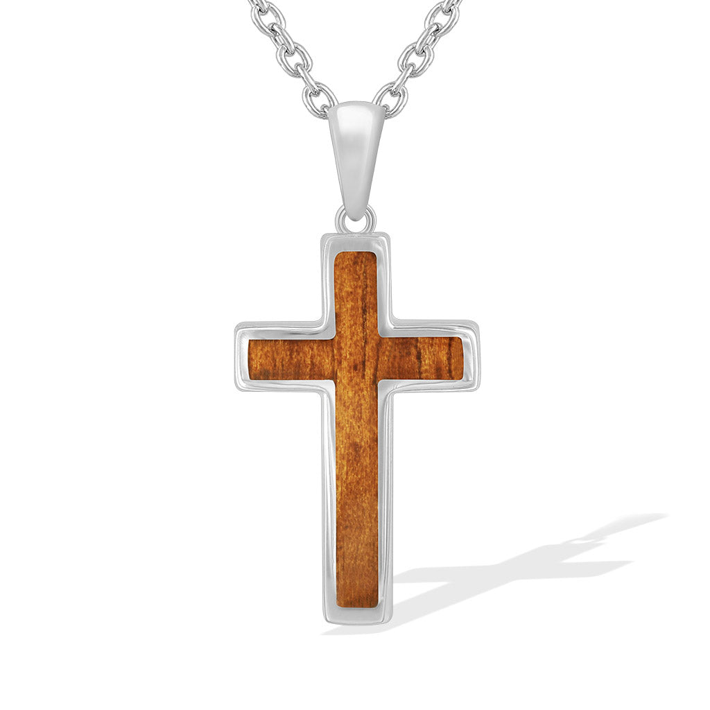 Sterling silver cross pendant featuring warm koa wood inlay and smooth polished edges. Item No. 767784