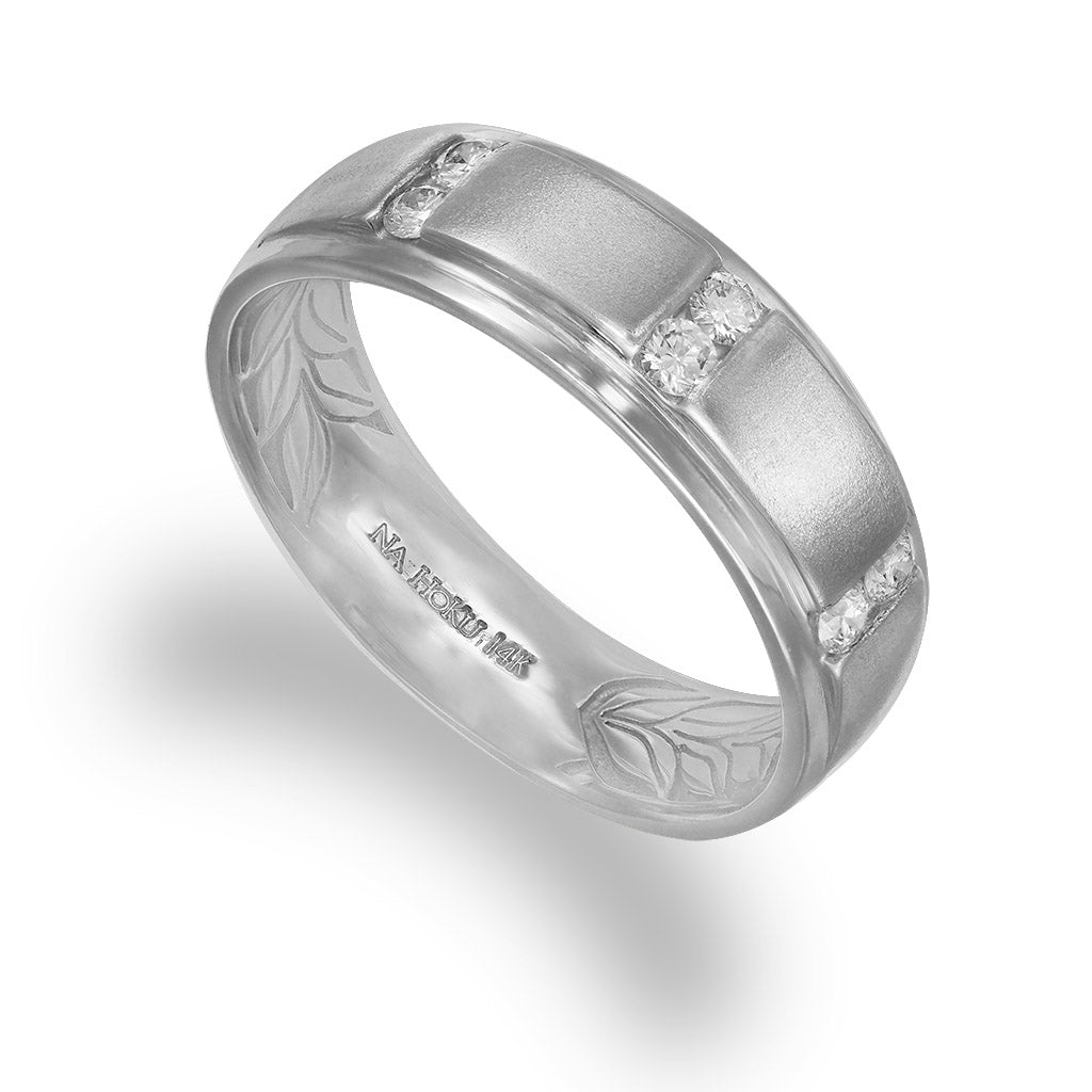 Satin-finished 14K white gold maile leaf band with 0.24 carats of diamonds and engraved leaf interior. Item No. 40493
