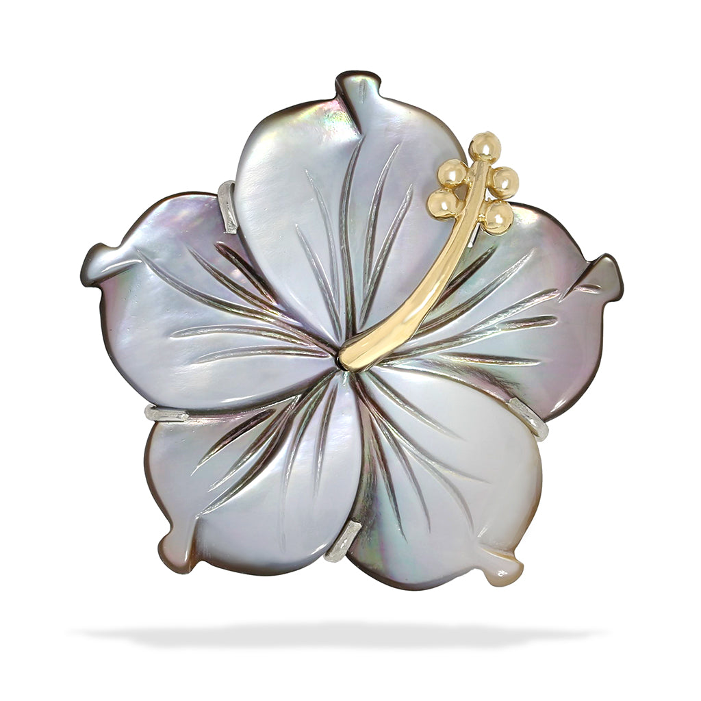 Hand-carved tahitian mother of pearl hibiscus pendant with a 14k yellow gold golden stamen. Item No. 40098