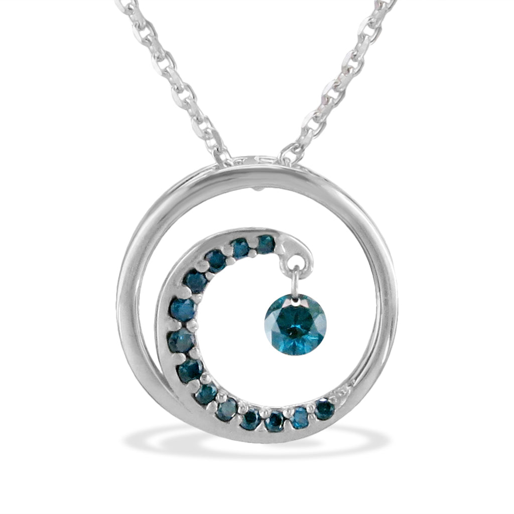 White gold wave pendant with blue diamonds and a dangling ocean-inspired accent shimmer stone. Item No. 40127