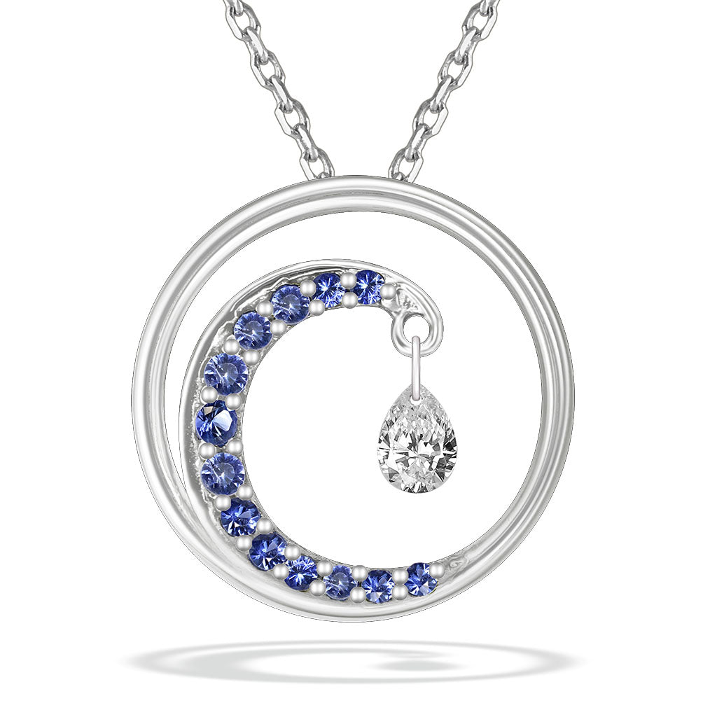 Small wave-like pendant in 14k white gold with a blue-sapphire accented crest & suspended shimmer diamond. Item No. 40150