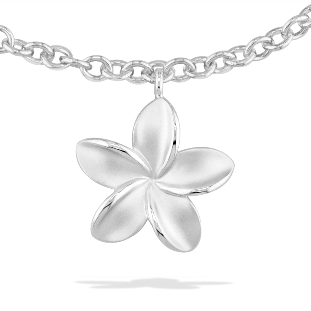 Zoomed in picture of the matte finished petals and polished inner edges for the plumeria charm. Item No. 40186