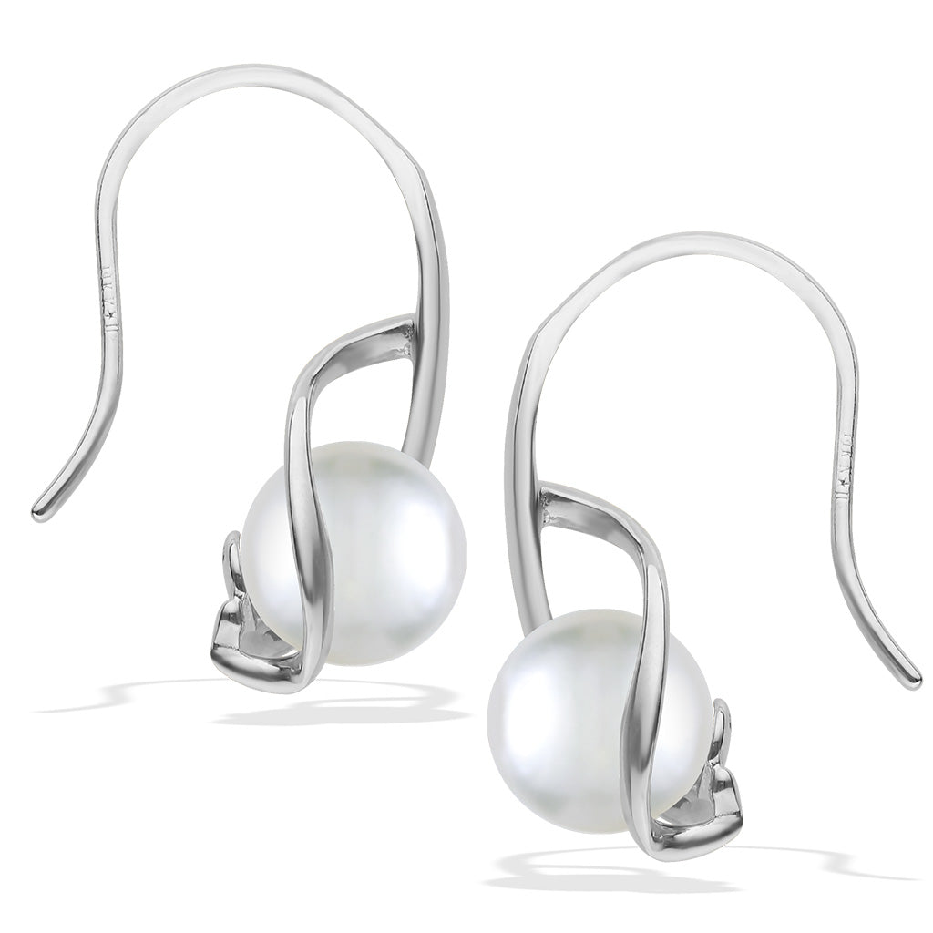 Angled view of white gold pearl earrings highlighting hook backs and smooth curves wrapping around each pearl. Item No. 40346