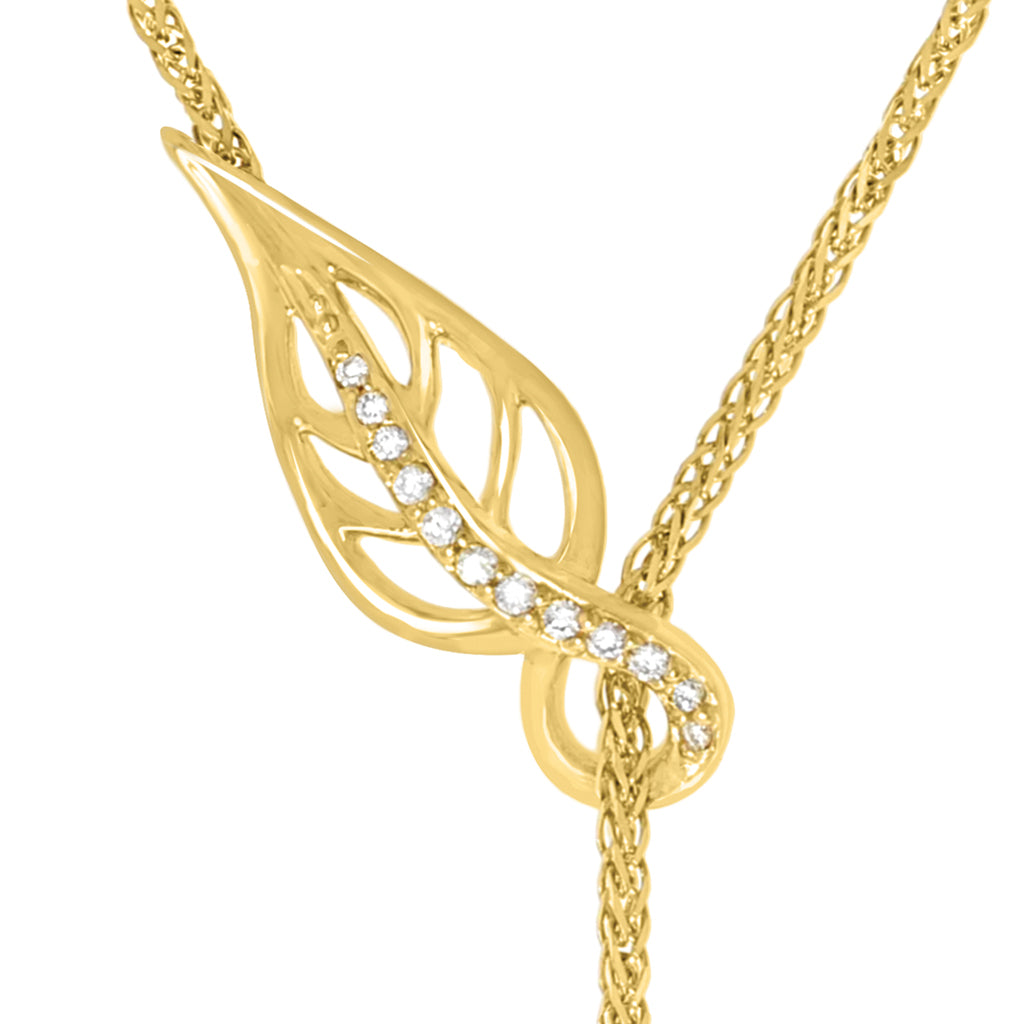 Close-up of diamond-set maile leaf detail on yellow gold lariat necklace with delicate chain tassel. Item No. 10268