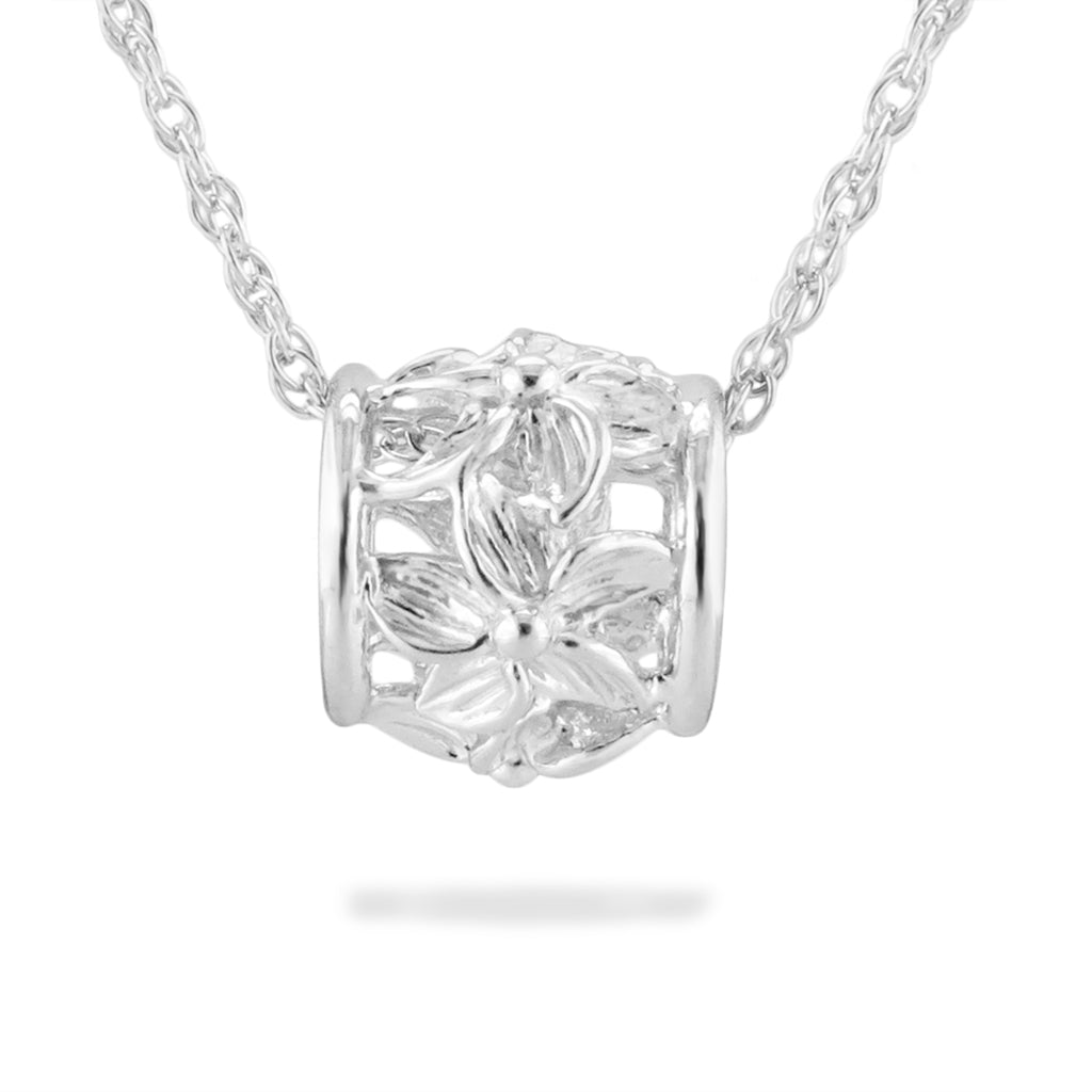 Medium sterling silver Lei Aliʻi puka pendant showing sculpted tropical flowers wrapped around the charm. Item No. 13494