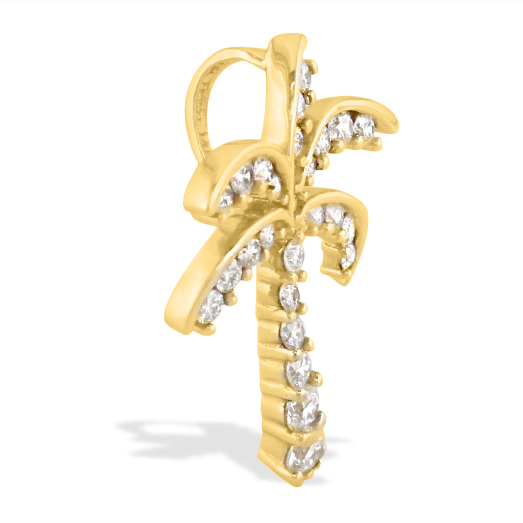 Angled profile of a yellow gold palm tree pendant with pavé diamonds accenting the bail and leaves. Item No. 13204