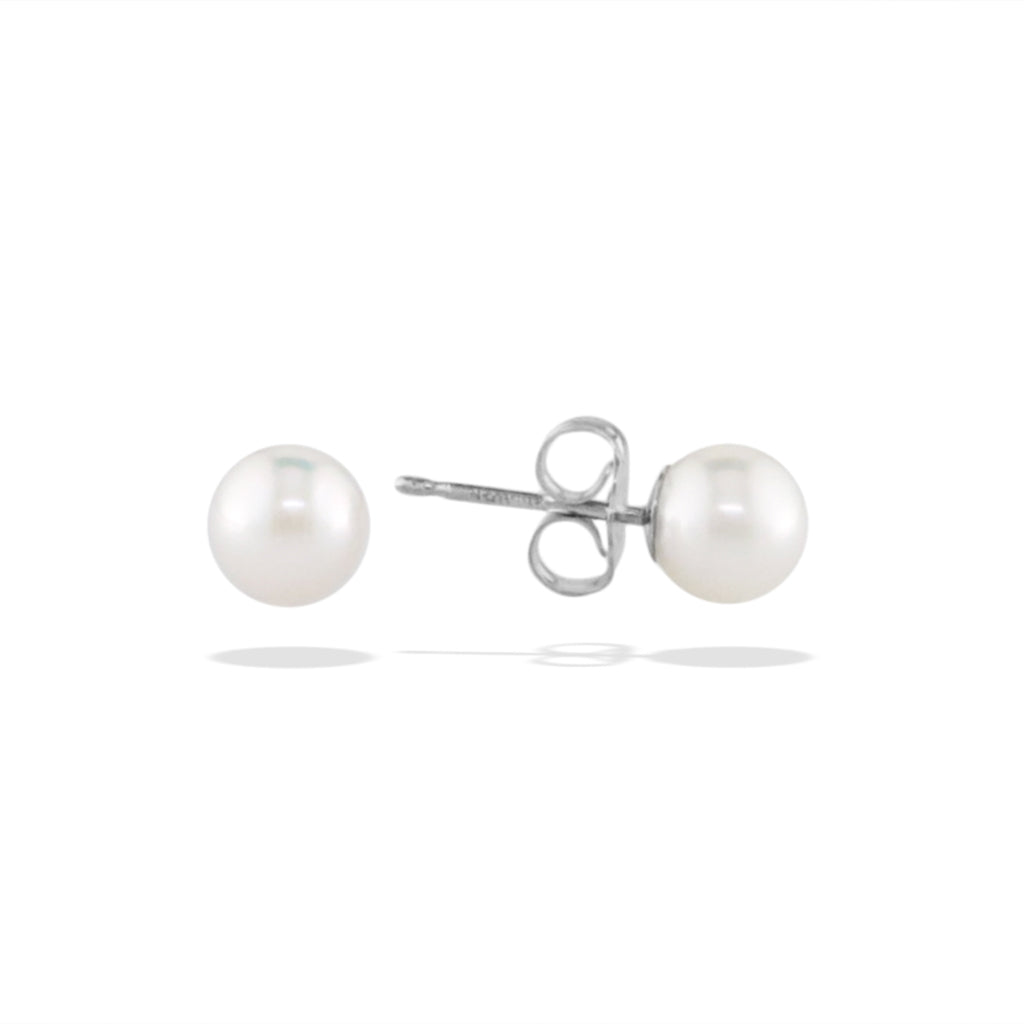 Petite white akoya pearl stud earrings with right side tilted to show the 14k white gold post and earnut. Item No. 14604