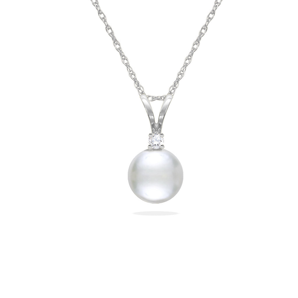 White gold pendant with a round white Akoya pearl and a small sparkling diamond above it. Item No. 14614