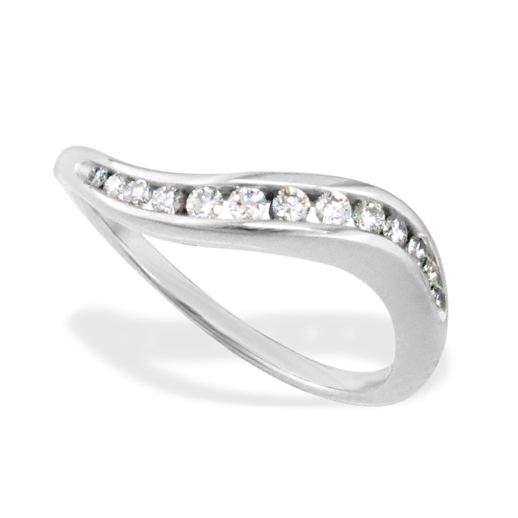 Elegant band with channel-set diamonds set in a curvy design, made in 14k white gold. Item No. 18959