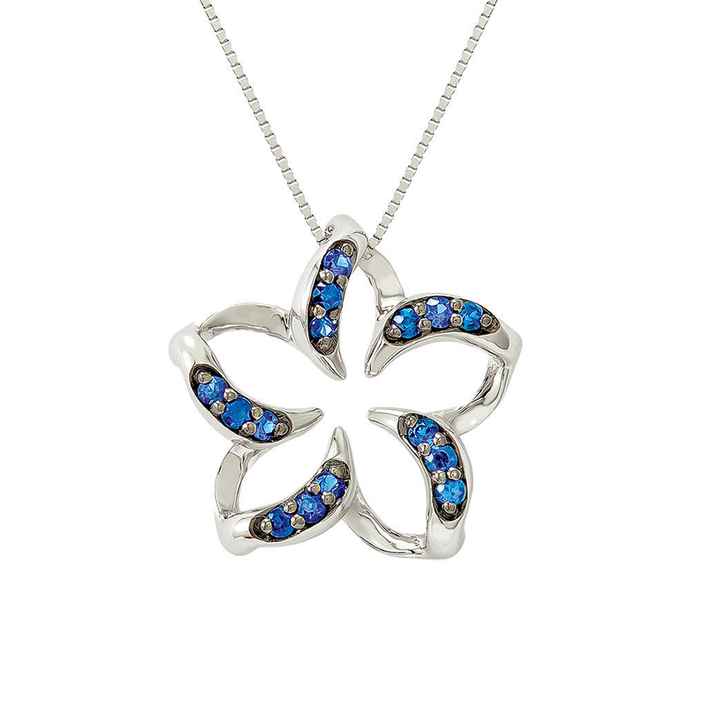 Polished white gold plumeria pendant with negative space center & blue sapphire lined curved petals. Item No. 19241