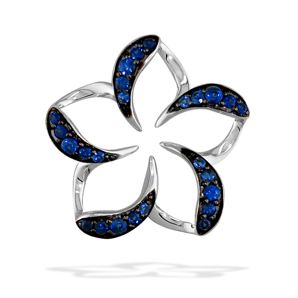 Large white gold plumeria pendant with five soft, blue sapphire-lined arched petals with negative space. Item No. 19288
