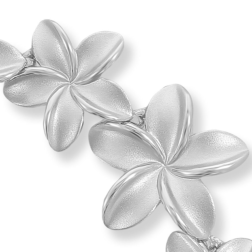 Close up view of the plumeria flowers matte finished texture and polished inner edges. Item No. 40530