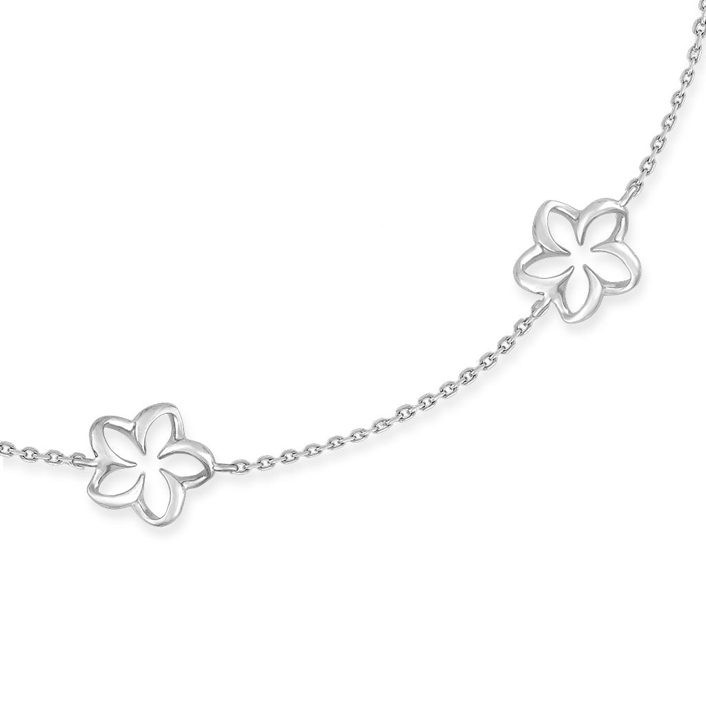 Detailed view of 14K white gold floating plumeria bracelet with linked open petal flowers. Item No. 41975