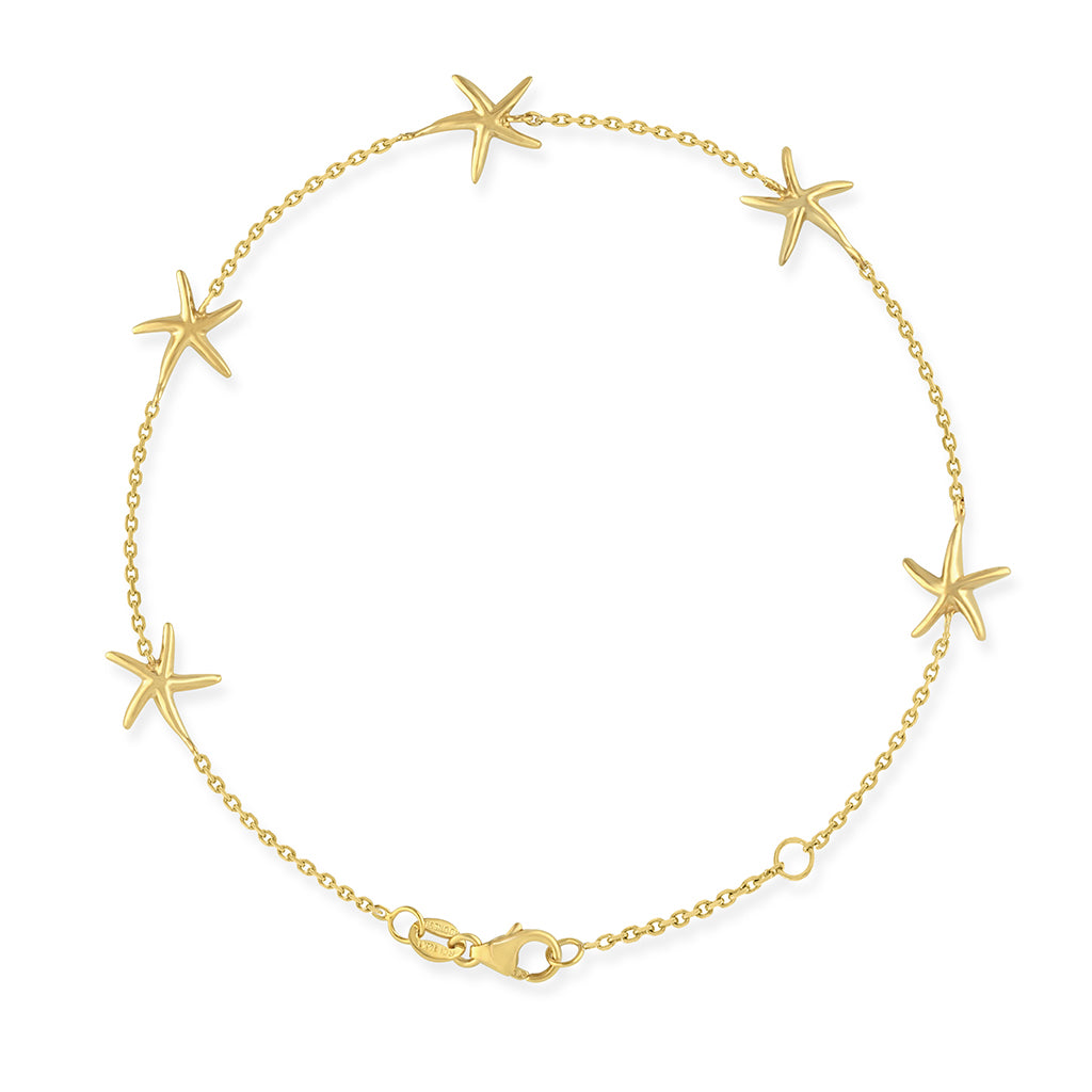 Starfish bracelet with adjustable jumpring and 5 evenly spaced starfish charms, set in 14k yellow gold. Item No. 41677