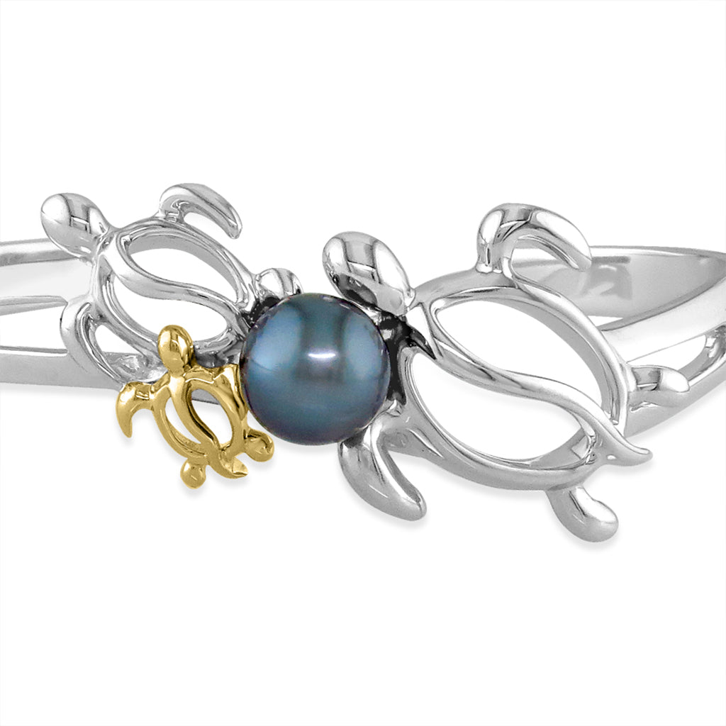 Zoomed in view of the sterling silver laser cut turtles with a center tahitian pearl & a baby 14k gold turtle. Item No. 41174
