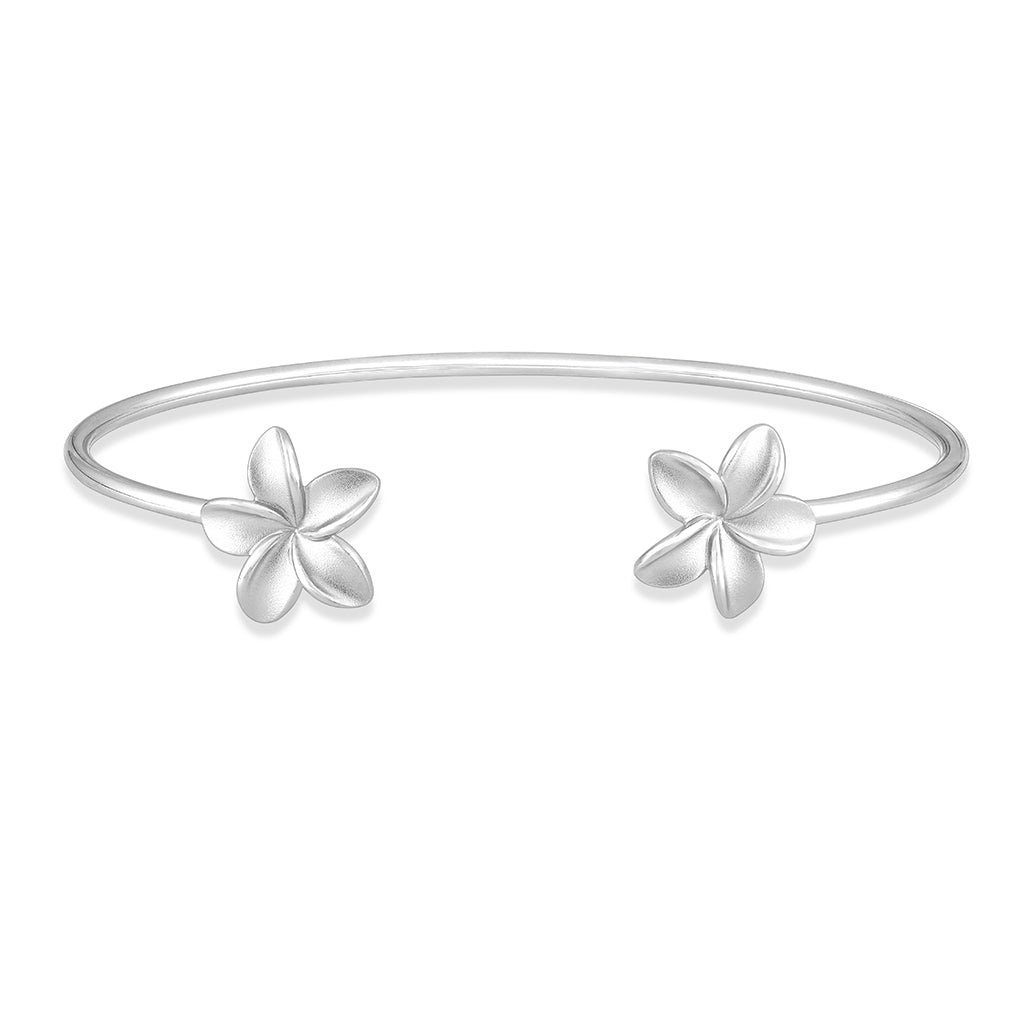Polished flexible open bangle with matte finished plumerias on each end, made in sterling silver. Item No. 41524