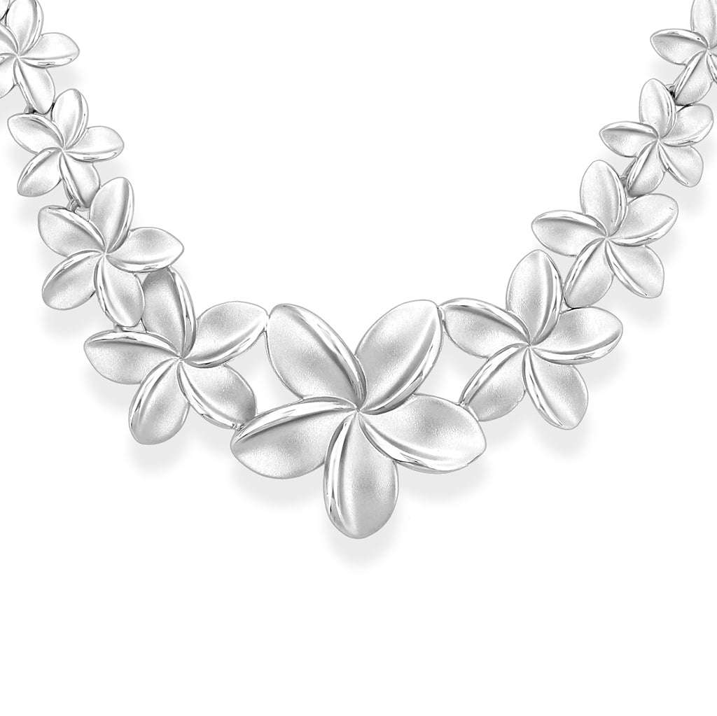 Detailed view of the graduated portion for the sterling silver plumeria necklace with a smooth matte finish. Item No. 40694