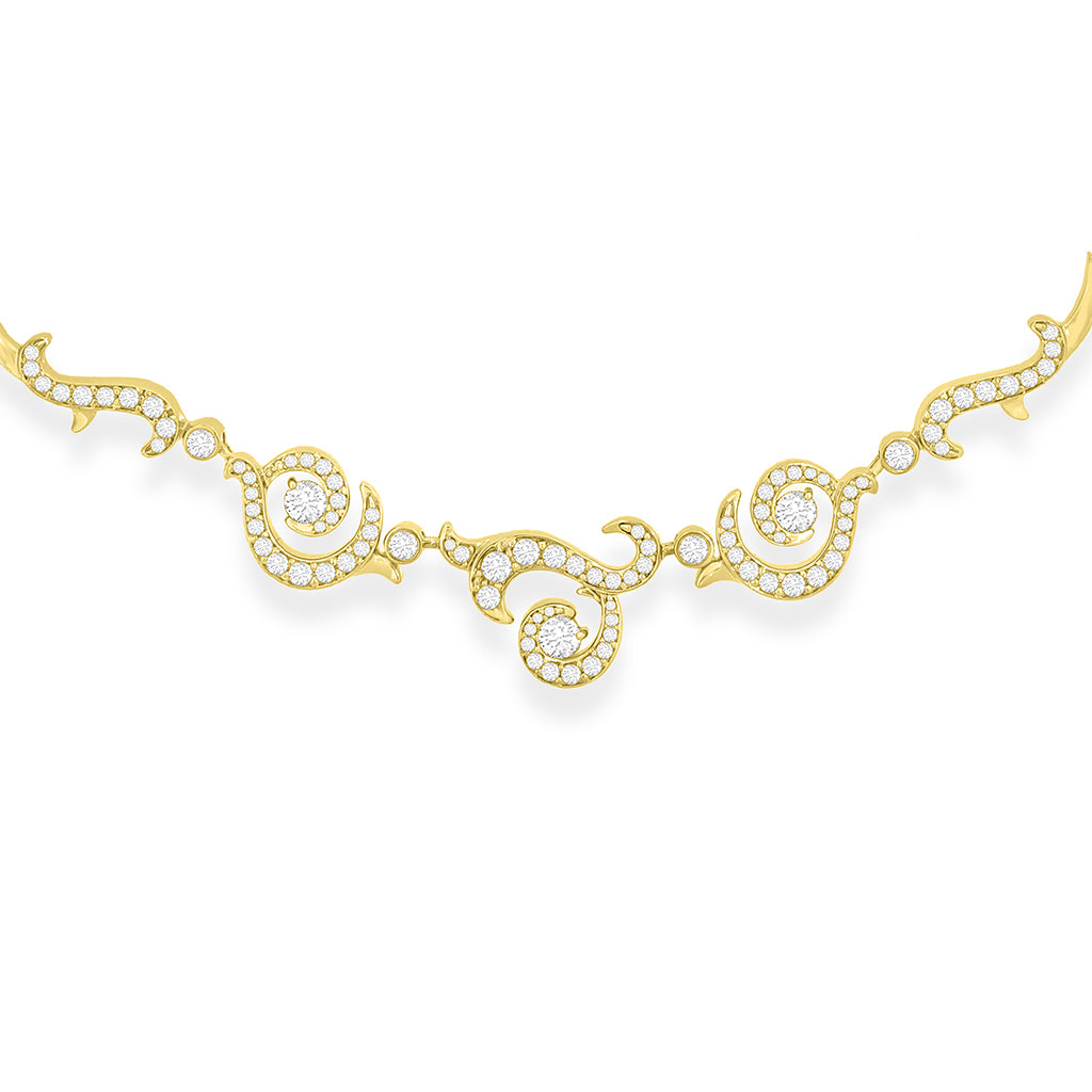 Close view of intricate golden whorls and swirls elegantly accented with pavé-set diamonds. Item No. 43370